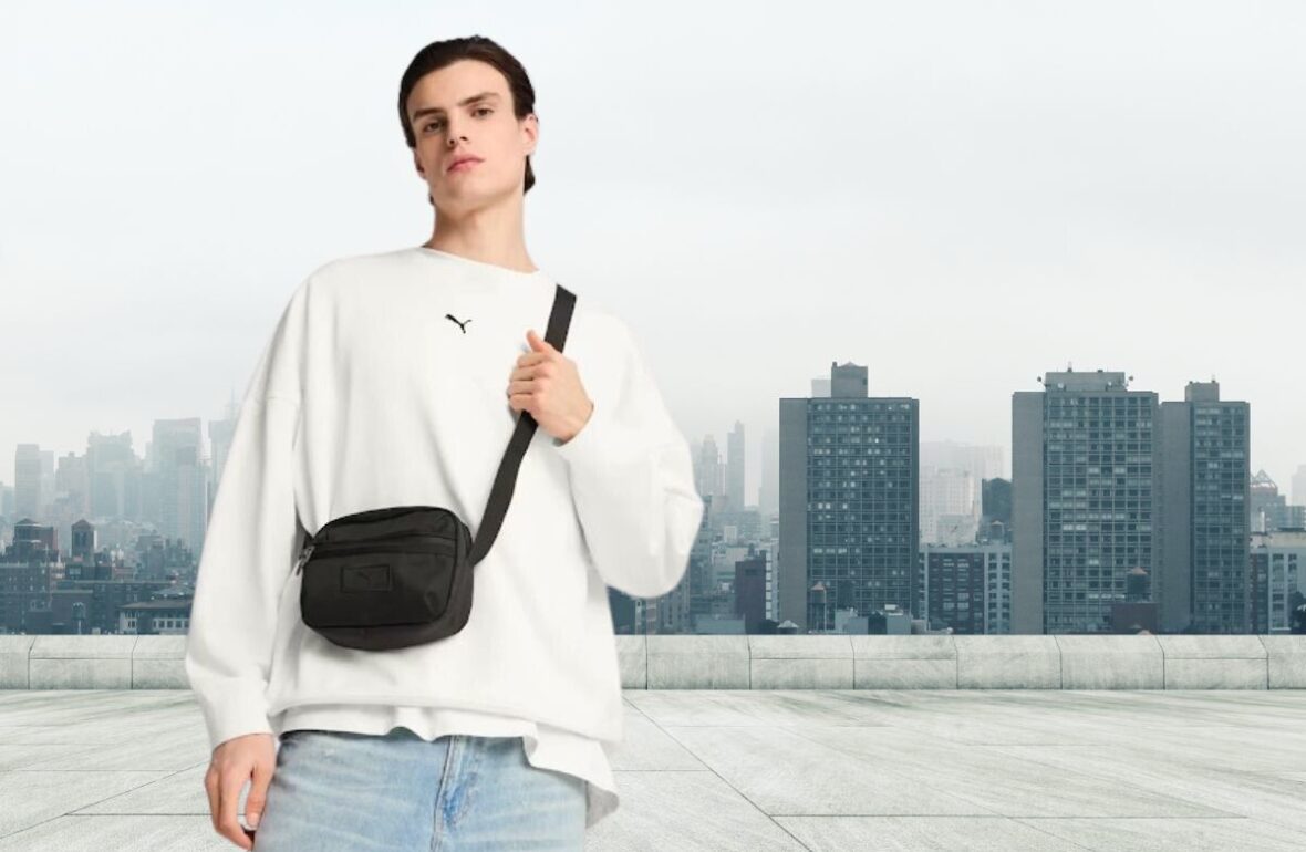 молодий чоловік на фоні міста